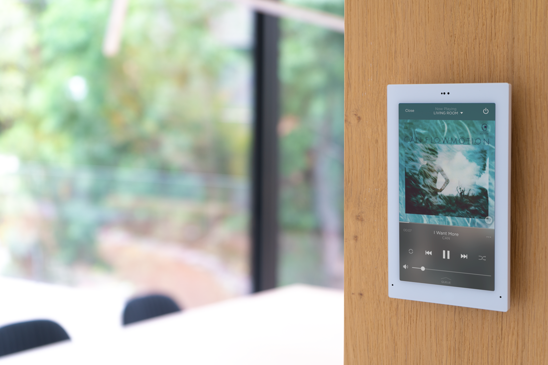 savant control panel on wood wall